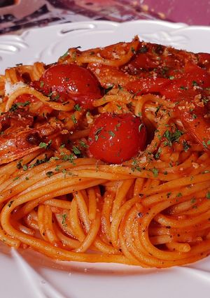 A picture of Cherry tomato and shrimp pasta.