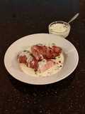 Roast Pork Tenderloin wrapped with Pastrami and served with a Romano / Marscapone Cream Sauce