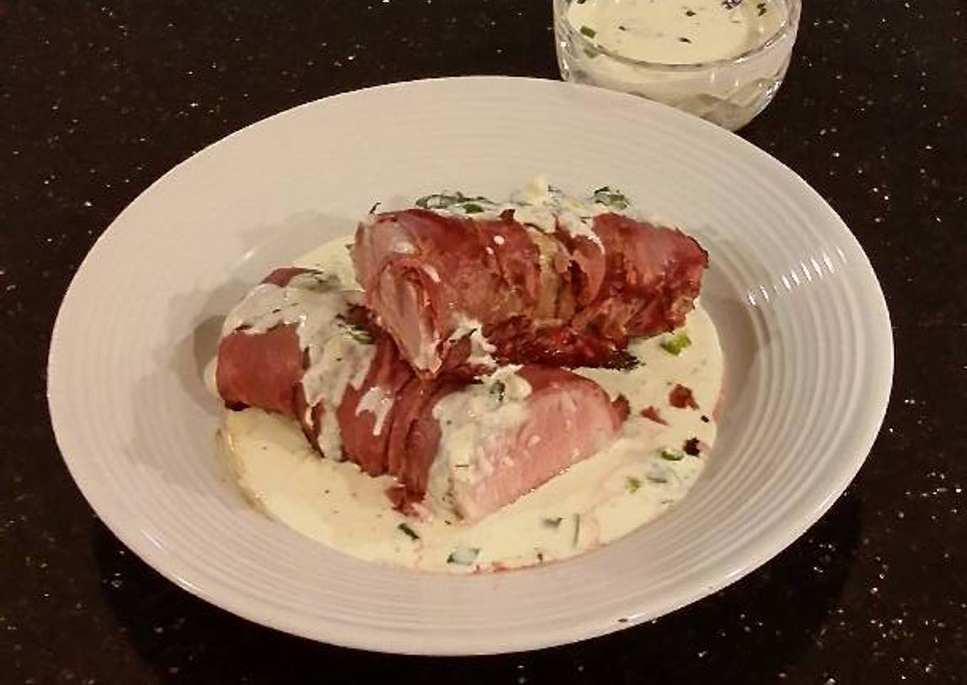 Roast Pork Tenderloin wrapped with Pastrami and served with a Romano / Marscapone Cream Sauce