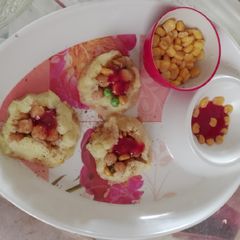 A picture of Corn with smashed potatoes.