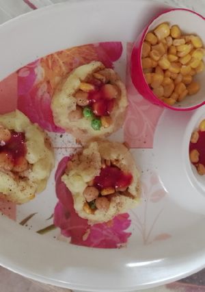 A picture of Corn with smashed potatoes.
