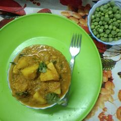 A picture of Nimona, Potatoes And Green Peas Curry.