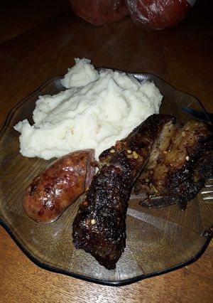 Una foto de Asado y chorizo a las brasas