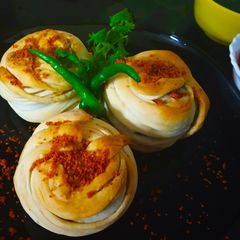 A picture of Lachha Baked Vada Pav.