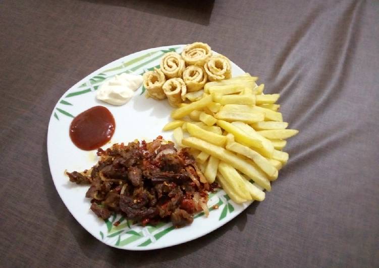 Fried chips and fried egg with Asun