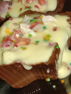 A picture of Fruits & nuts custard in choco cups.