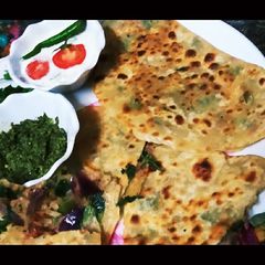 A picture of Half Moon Spanich Green Oinon Crep Paratha.