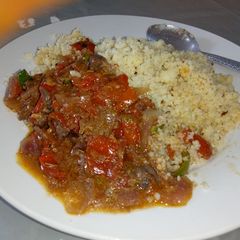A picture of Cous Cous nd tomatoe sauce.