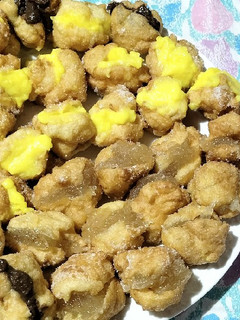Una foto de Buñuelos de viento de cabello de ángel crema pastelera y chocolate