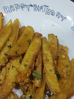 A picture of Chatpatay crispy potato wedges.