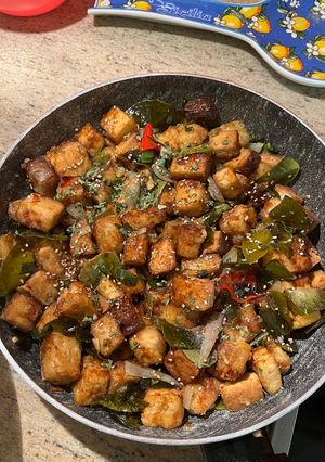 A picture of Tofu with lime leaves.
