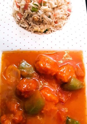 A picture of Chicken Shashlik with Vegetable fried Rice.