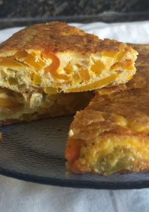 Una foto de Tortilla de zapallo, cebolla y ají