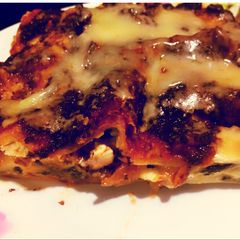 A picture of Eggplant lasagna with black olive tapenade.