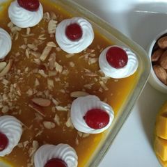 A picture of Mango flavoured milk cake in two layers.