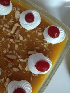 A picture of Mango flavoured milk cake in two layers.