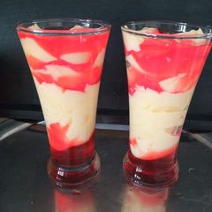 A picture of Vanilla Custard with strawberry jelly.