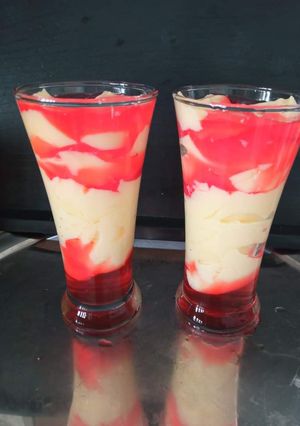 A picture of Vanilla Custard with strawberry jelly.