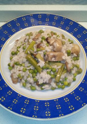 Foto di Risotto light con funghi porcini punte di asparagi e piselli