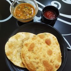 # masala aalu kachauri with matar tamatar sabji A picture of # masala aalu kachauri with matar tamatar sabji.