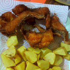 A picture of Fish and roast potatoes.