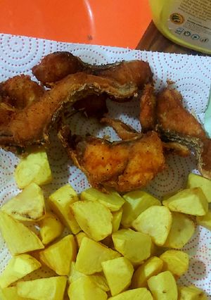 A picture of Fish and roast potatoes.