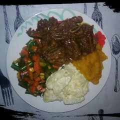 A picture of Beef stew with salads.