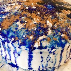 A picture of Sponge cake with fondant icing and chocolate powder.