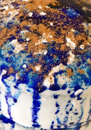 A picture of Sponge cake with fondant icing and chocolate powder.