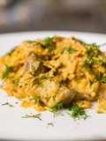 Chicken gizzards stewed in sour cream