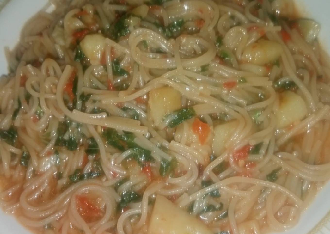 Spaghetti Jollof with Irish Potatoes