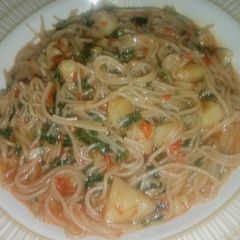 Spaghetti Jollof with Irish Potatoes A picture of Spaghetti Jollof with Irish Potatoes.
