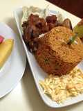 Jollof rice with salad, pepper kpomo and fried chicken