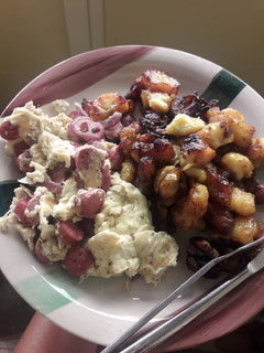 A picture of Blessing’s Fried sauté egg & sausages and plantain.