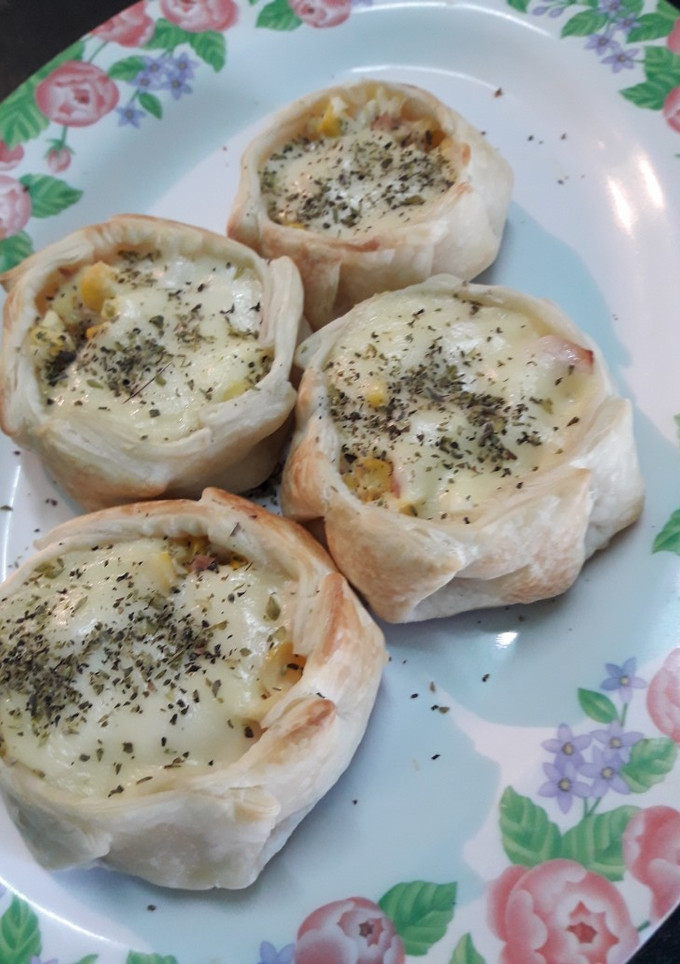Una foto de Canastitas de choclo con salsa Blanca