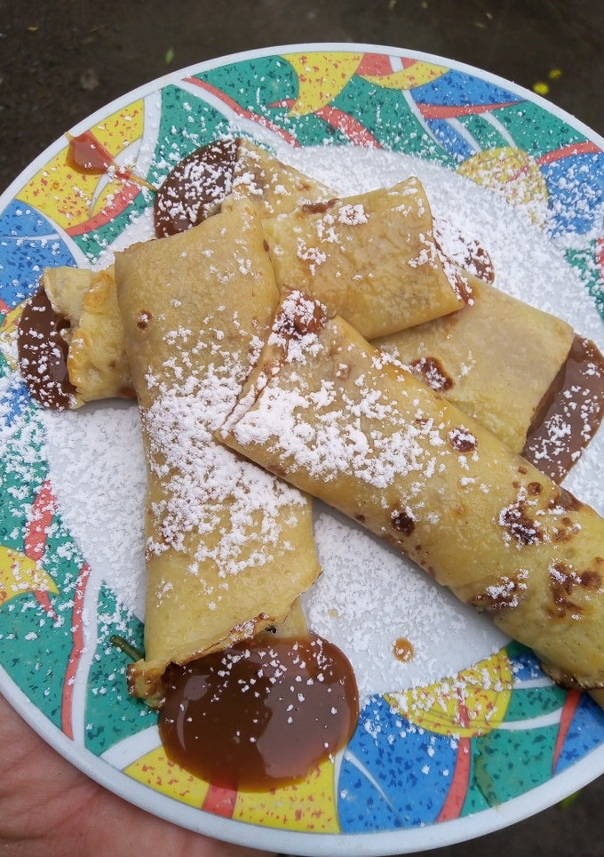 Una foto de Panqueques rellenos de dulce de leche delicioso 😋