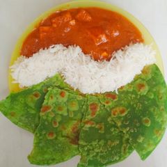 A picture of Paneer Butter Masala with Rice and Palak Paratha.