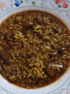 Una foto de Arroz meloso de gambón y sepia