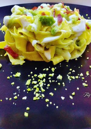 Foto di Pappardelle con cavolfiore verde, crema di ricotta e provola piccante, speck croccante