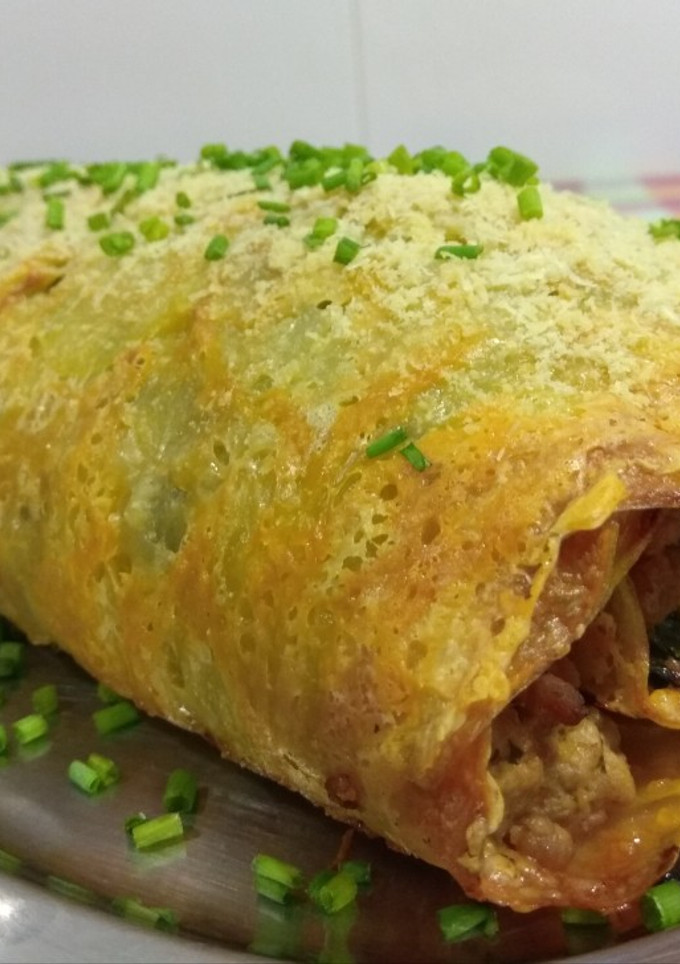 Una foto de Rollo de patata, carne y espinacas