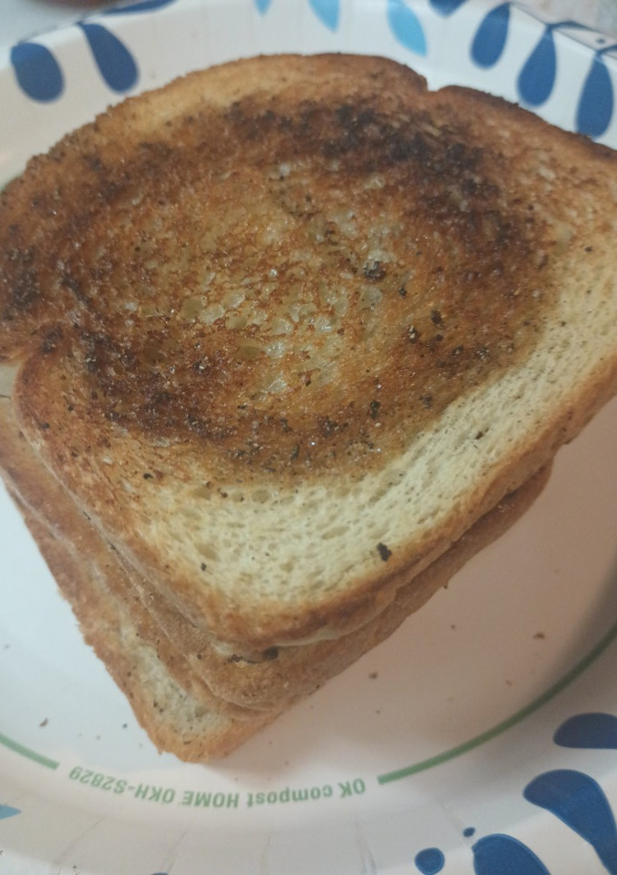 A picture of Toast with Butter and Black Pepper.