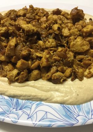 A picture of Chicken Shawarma with Hummus.