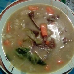 A picture of Vegetable soup with bones.
