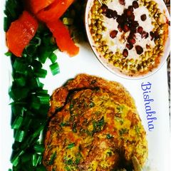 A picture of Moong daal Spinach pancake with Sprouts Raita.