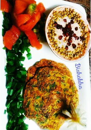 A picture of Moong daal Spinach pancake with Sprouts Raita.