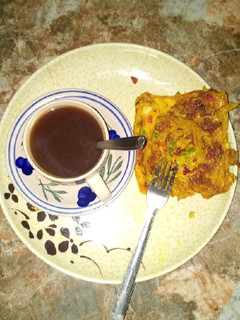 A picture of Bread omellete with tea.