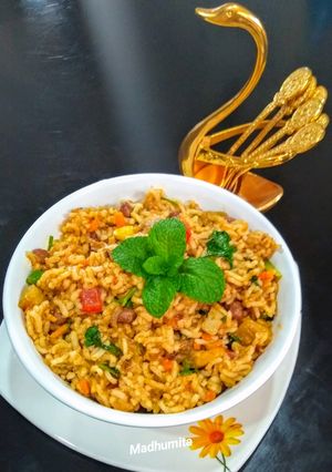 A picture of Schezwan Veg Biryani.