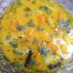 A picture of Raw moong daal with bottle gourd and pumpkin.