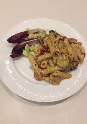 A picture of Wholewheat pasta with sun- dried tomatoes, courgette and chorizo.