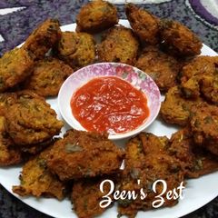 A picture of Moong Daal Fritters with Purslane Leaves.